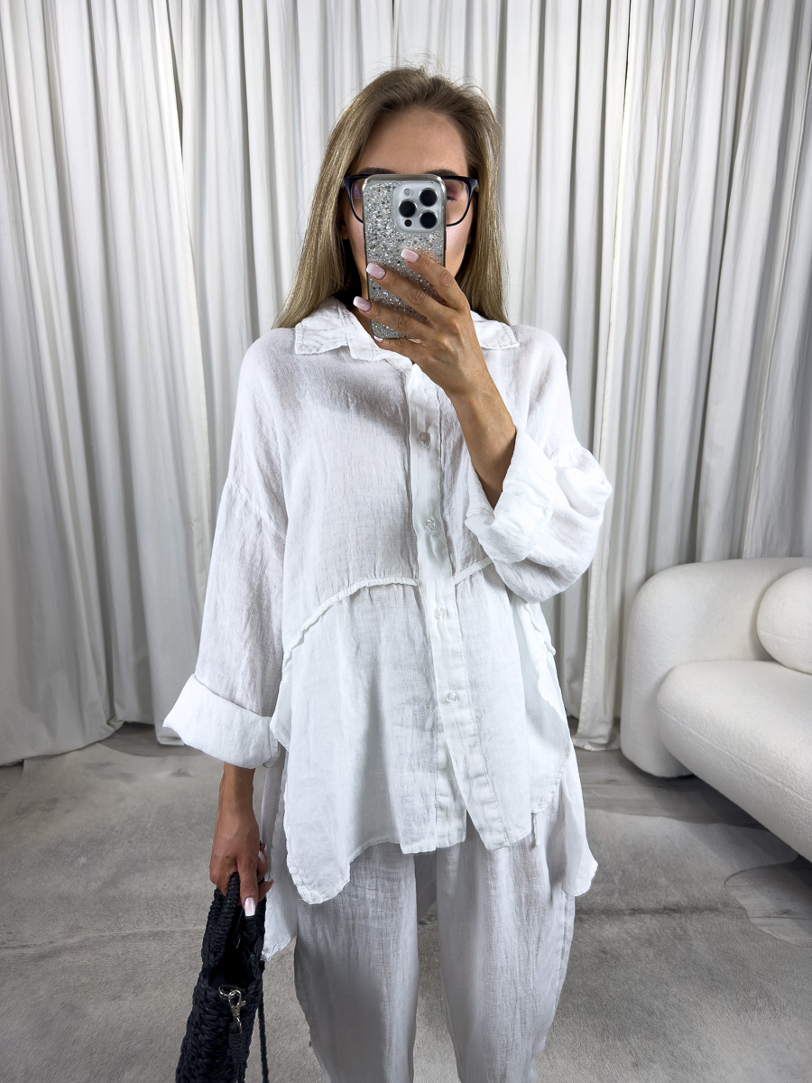IMG_4137 Biała lniana koszula Lori od Wiya to przewiewny model w stylu oversize. Naturalny len, eleganckie przeszycie i komfortowy krój. Stylizacja z białymi, lnianymi spodniami.